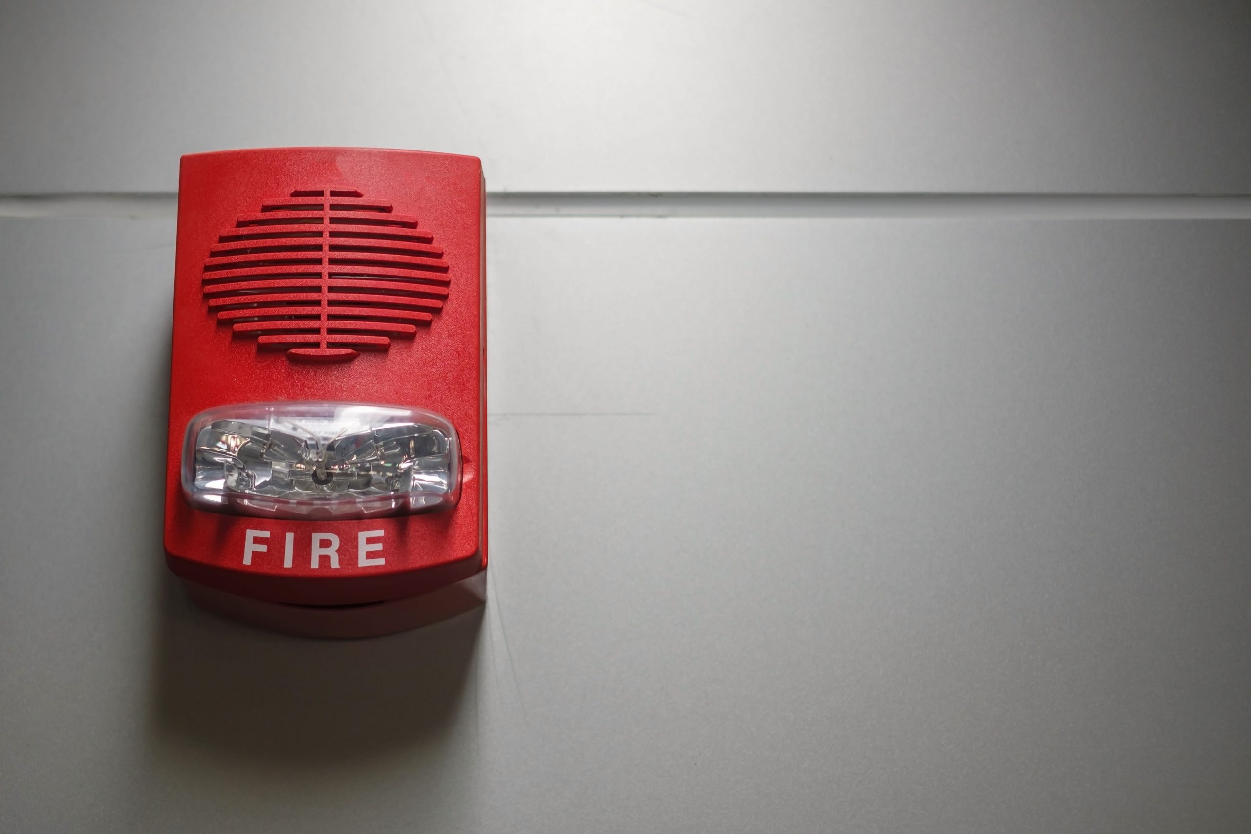 Fire alarm switch on the wall, powerful emergency equipment for industrial and residential